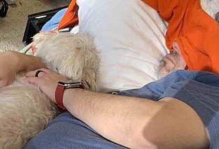 Finn and I asleep on the couch in what was my office in the basement. My hoodie acts as a make-shift sleep mask.