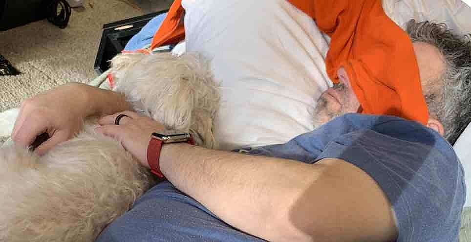 Finn and I asleep on the couch in what was my office in the basement. My hoodie acts as a make-shift sleep mask.